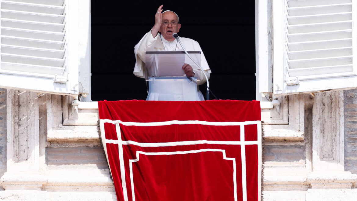 Pope Francis leads the Angelus prayer from his window at the Vatican